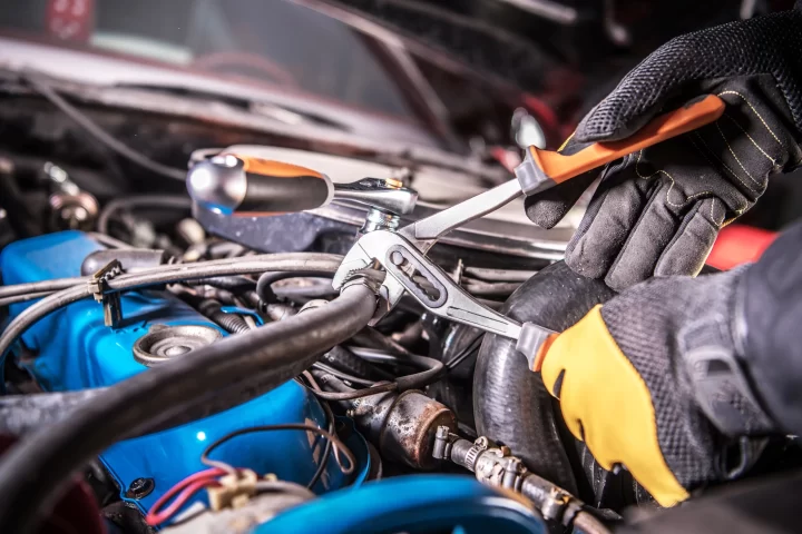 Auto Repair mechanic working on a car